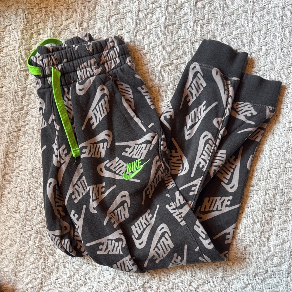 Nike Kids' Black and Gray Logo Joggers with Green Details